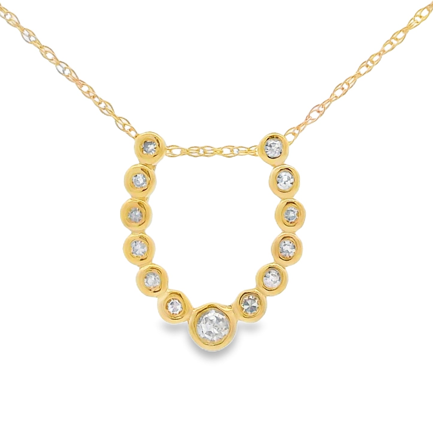 A gold necklace with a delicate chain and a U-shaped pendant featuring small round clear stones and one larger central clear stone, shown on a plain white background.