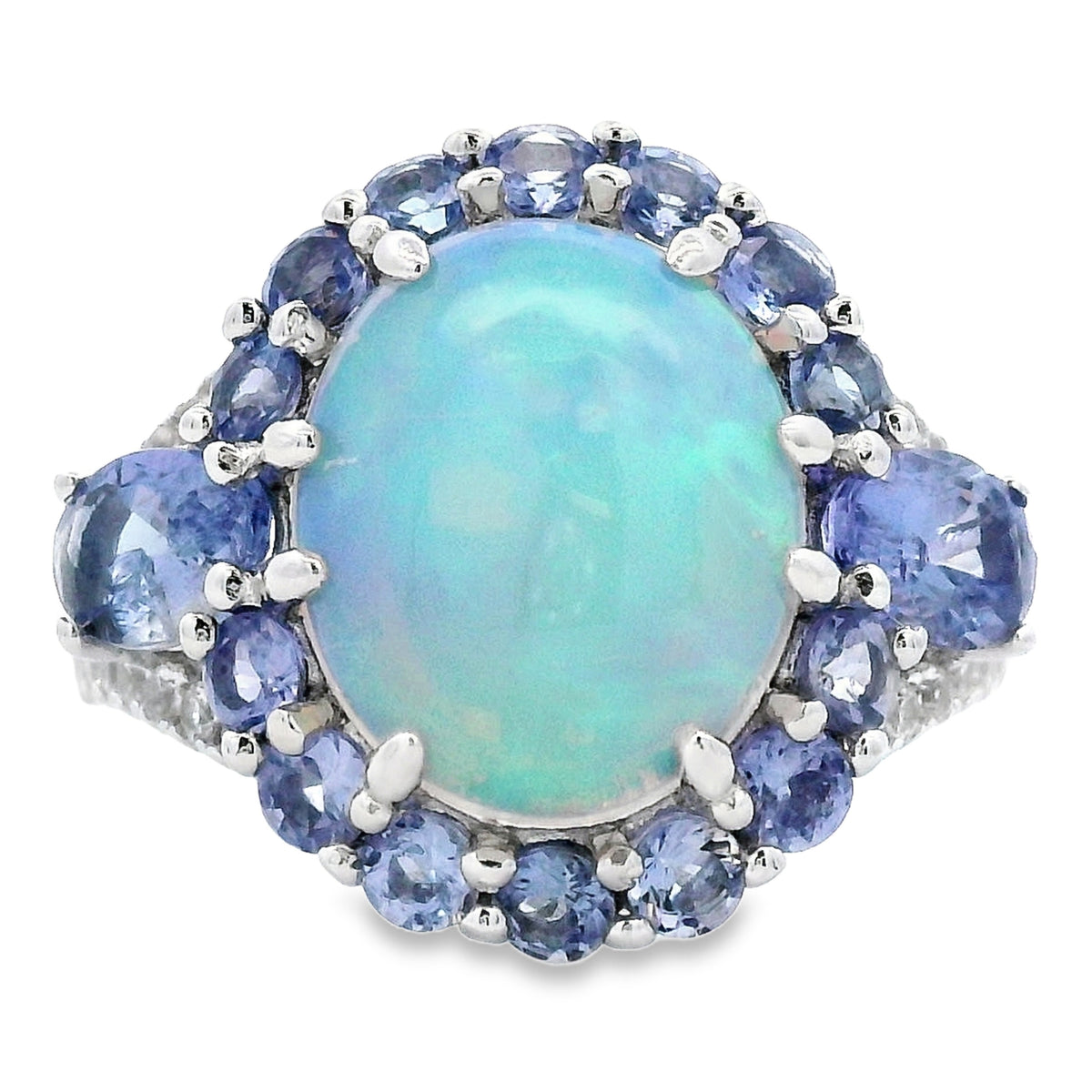 12x10mm Ethiopian opal and tanzanite halo ring in sterling silver, top view of aqua-blue oval opal surrounded by violet-blue tanzanites