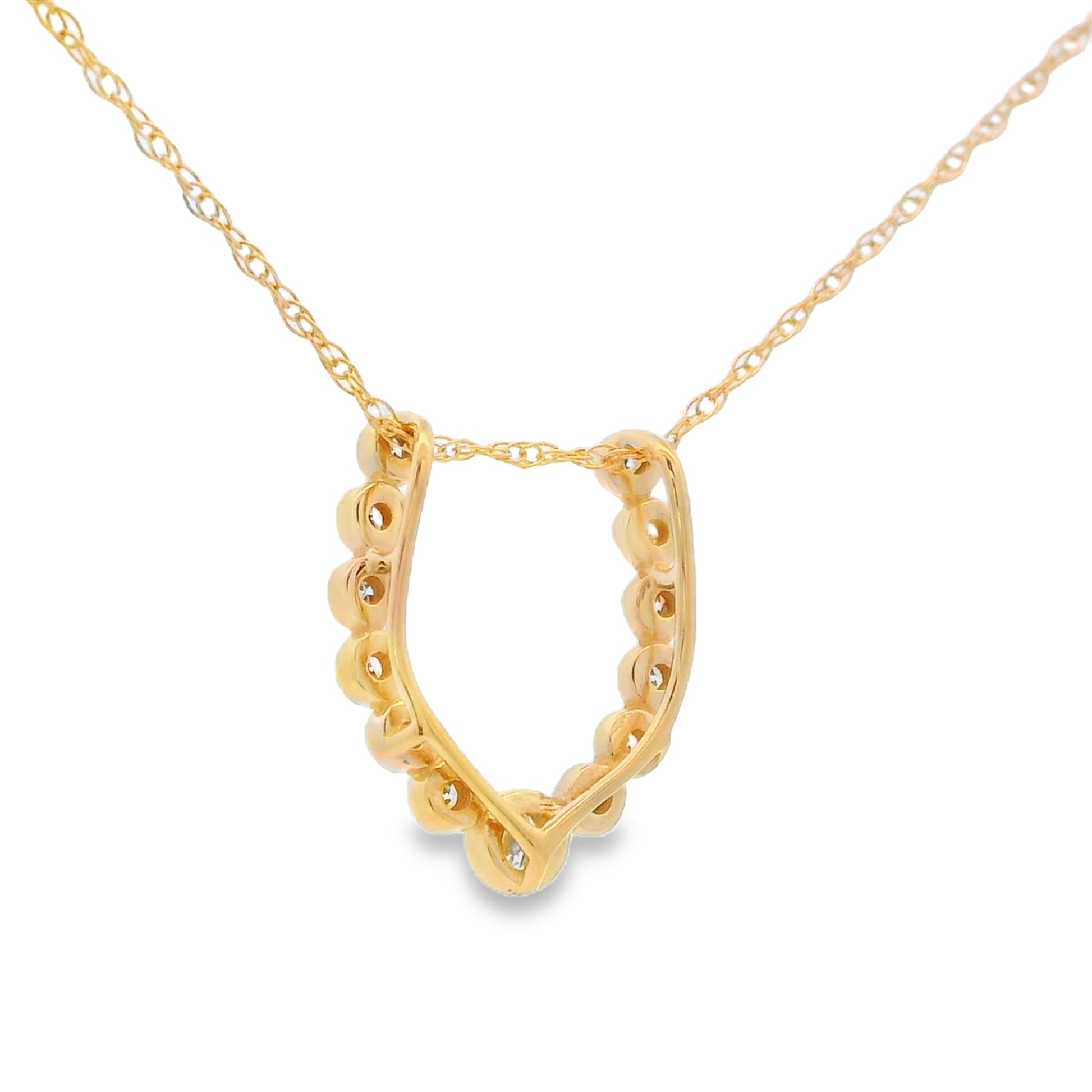 A gold necklace with a decorative open pendant featuring small clear stones set along the curved border, displayed on a clean white background.